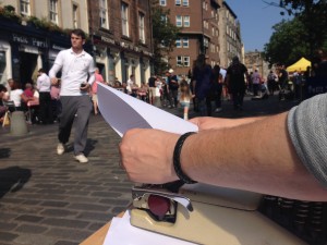 Getting set up on Grassmarket in Edinburgh. Photo by Marc Seestaedt, getting